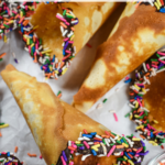 Homemade ice cream cone with rainbow sprinkles