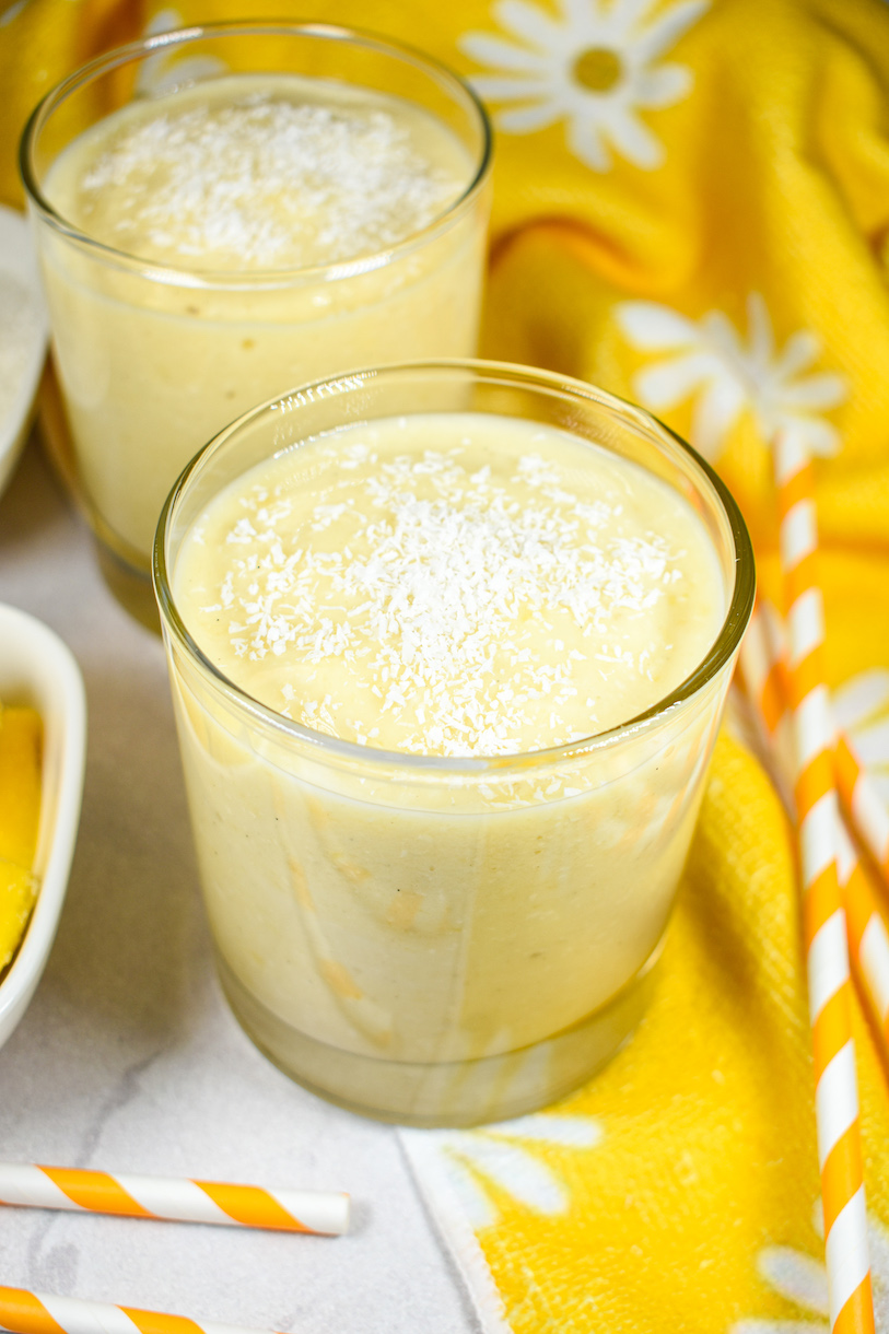 a mango smoothie garnished with coconut