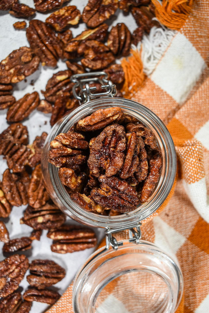 A jar of maple pecans and an orange towel