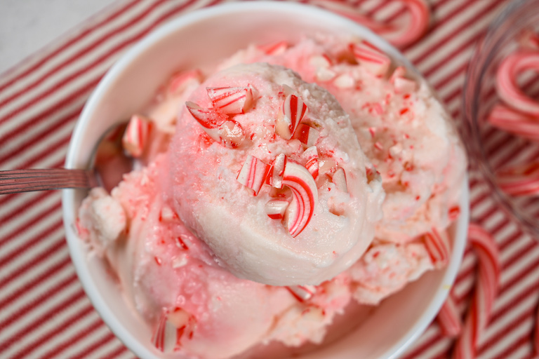 A bowl of ice cream garnished with crushed candy canes