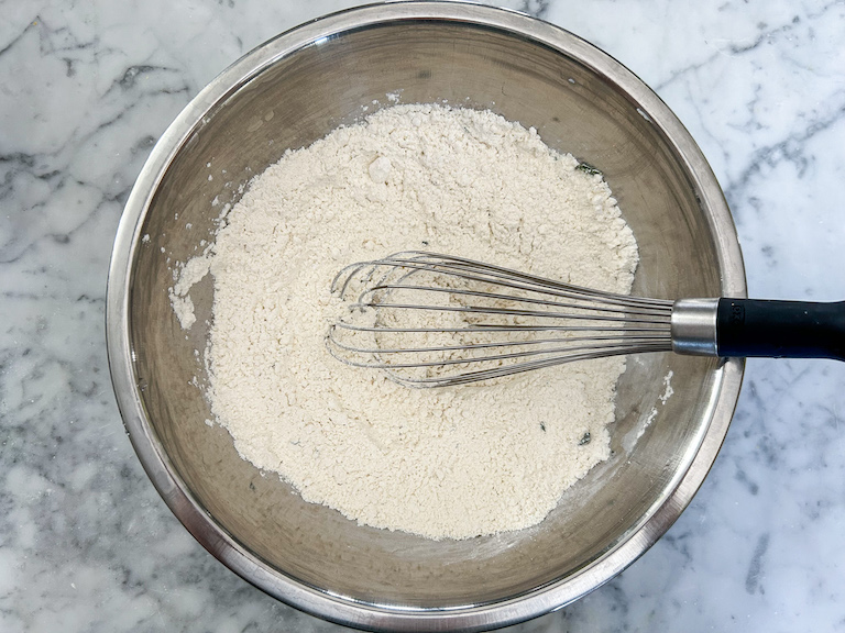 Dry ingredients in a bowl with a whisk