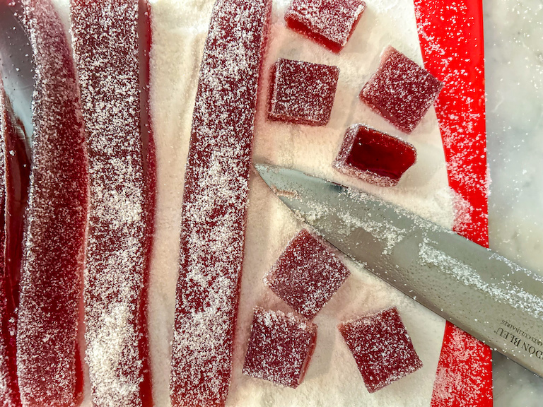 Knife cutting cranberry candy