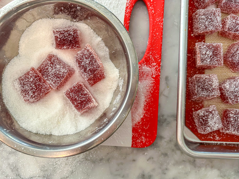 Cranberry candies in a bowl of sugar