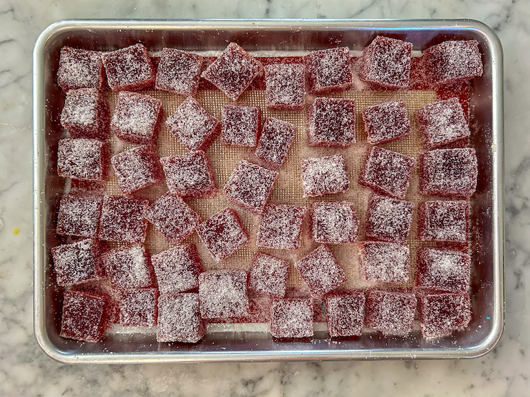 Cranberry jelly candies drying on a tray