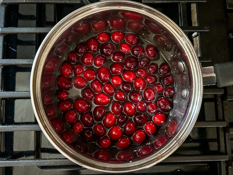 Cranberries and water in a saucepan