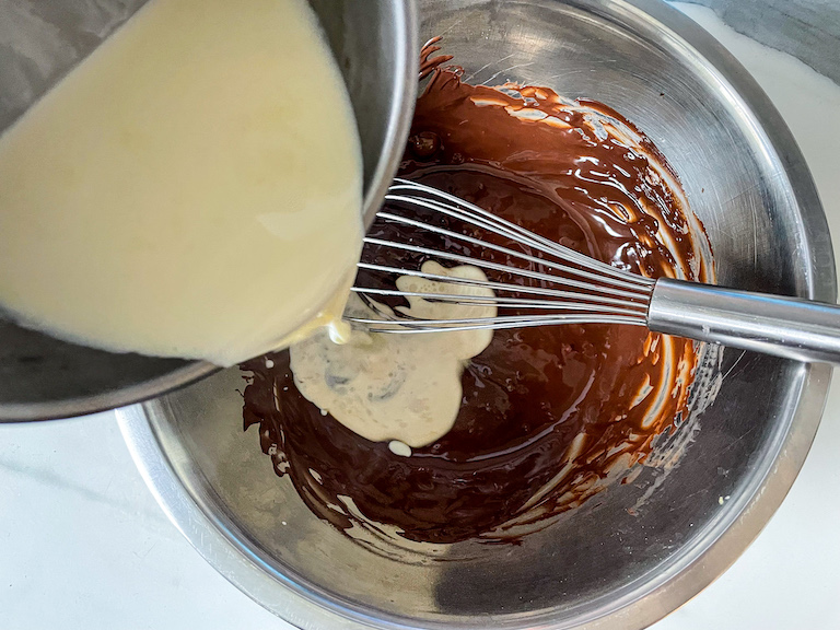 Pouring cream into melted chocolate