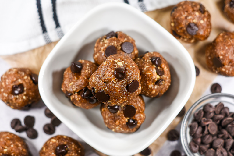 Looking down at a bowl of chocolate chip date balls