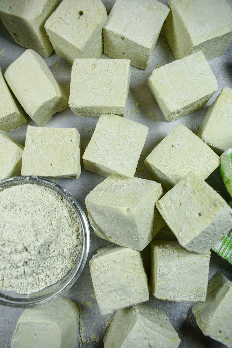 matcha marshmallows arranged on a white surface