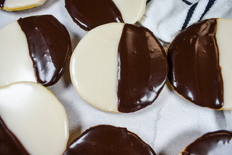 Black and white cookies on a white surface