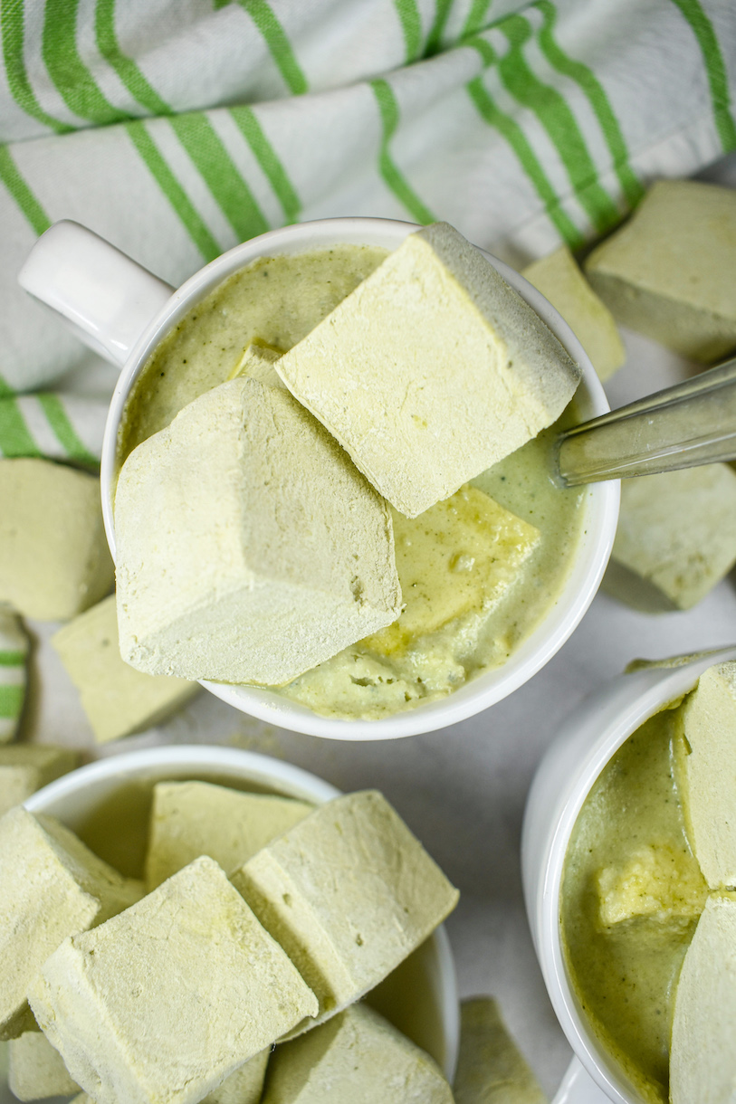 mugs of matcha hot chocolate with marshmallows on top