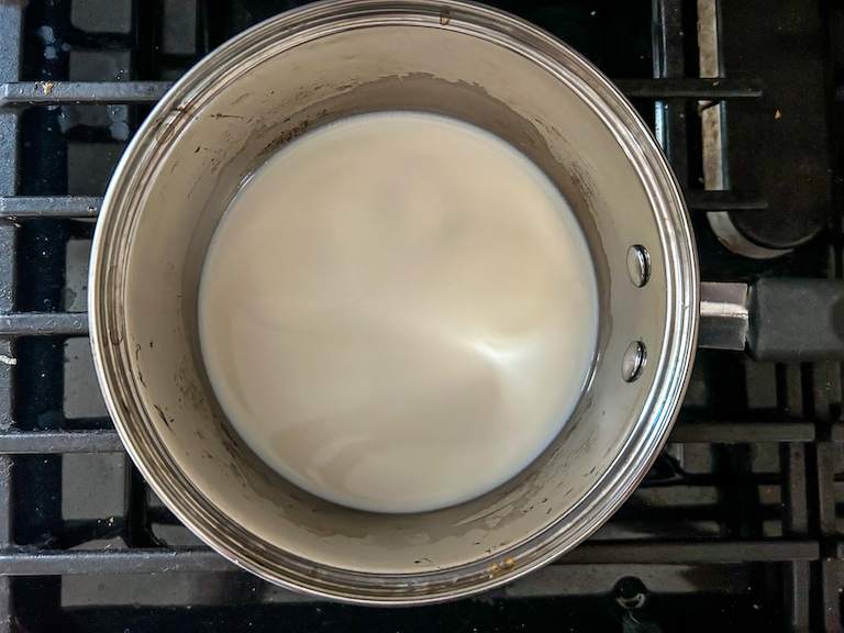 A pan of milk on the stovetop