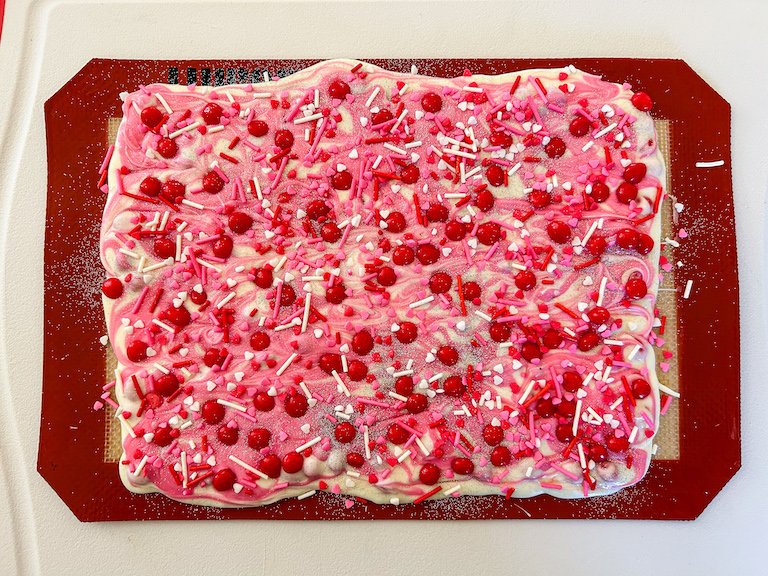 A slab of cinnamon bark on a silicone mat