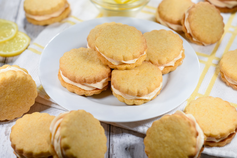 A plate of lemon cream sandwich cookies