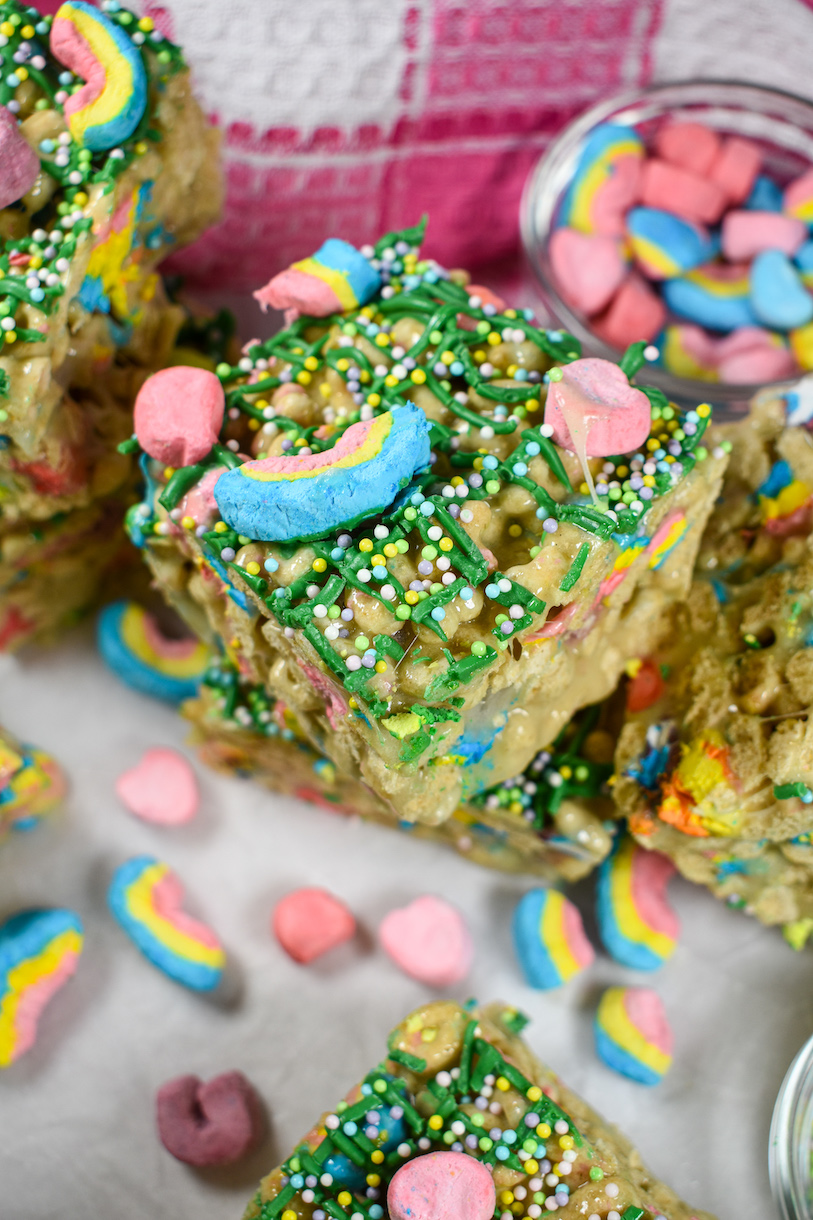 Lucky Charms treats surrounded by pastel colored cereal marshmallows