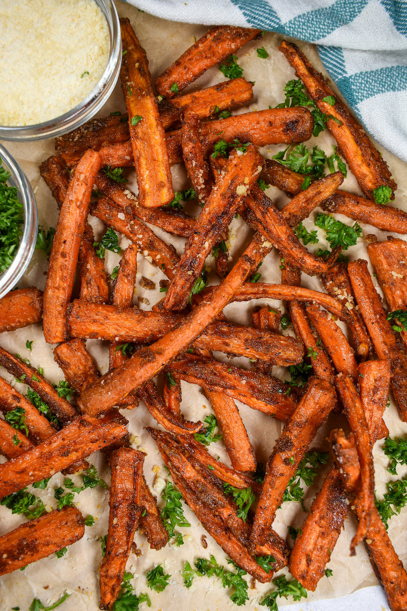 Carrot fries on a sheet of parchment