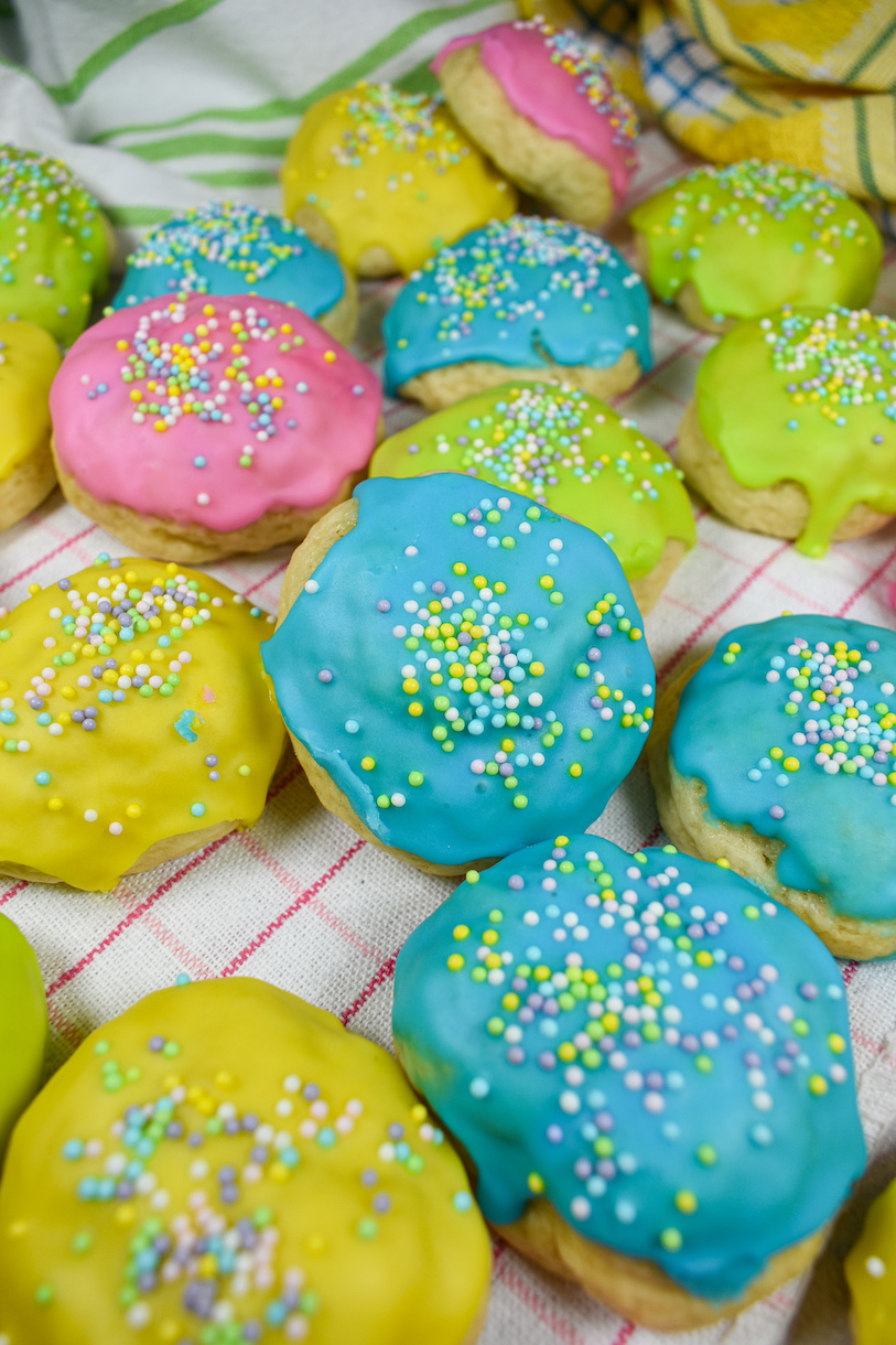 italian easter cookies arranged on a pink plaid towel