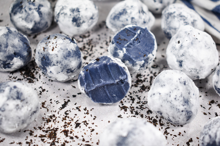 Earl Grey tea truffles on a white surface
