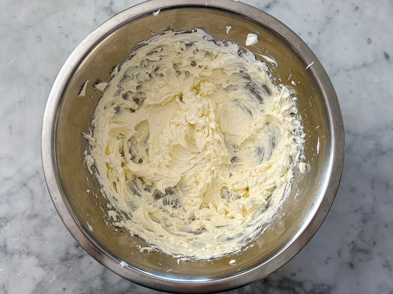 A bowl of whipped cream cheese