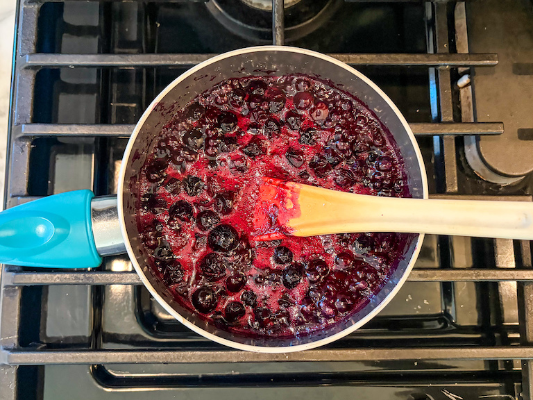 Blueberry compote cooking on the stovetop