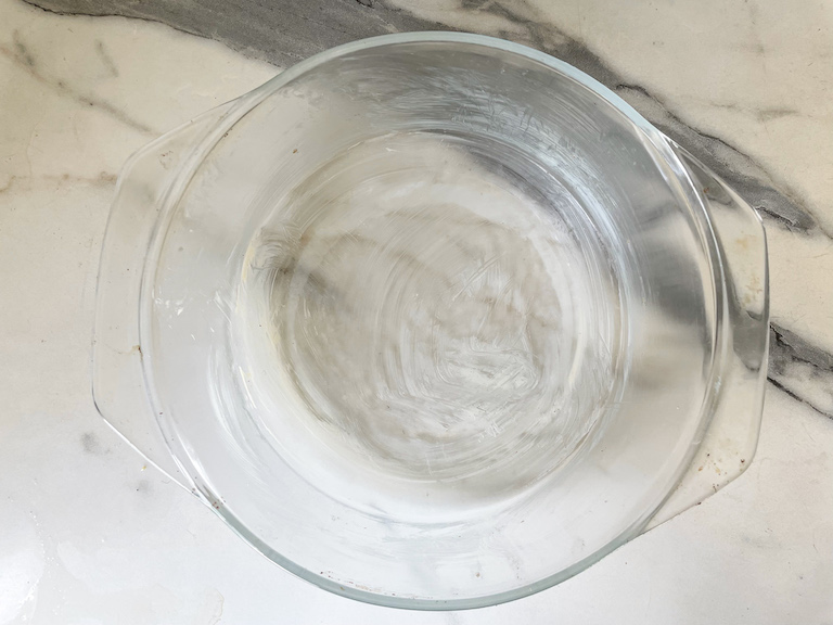 A buttered glass baking dish