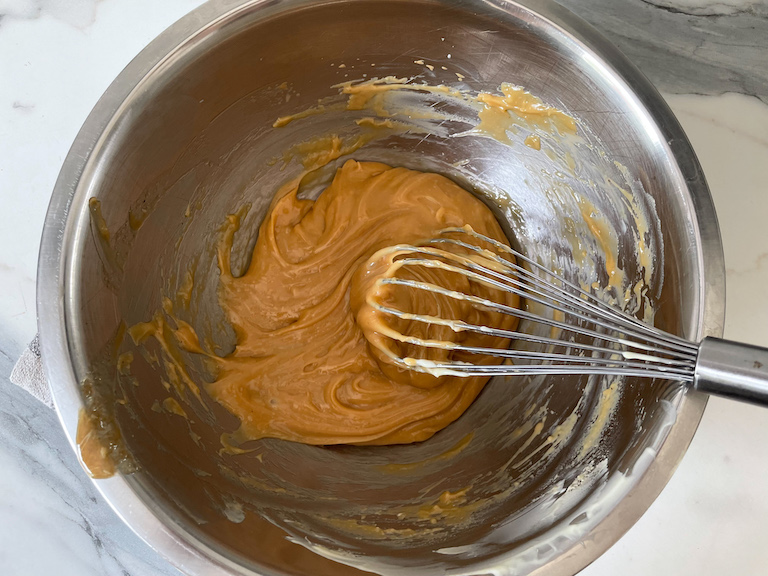 Earl Grey ganache in a bowl with a whisk