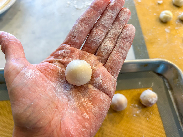 Hand holding a ball of fondant