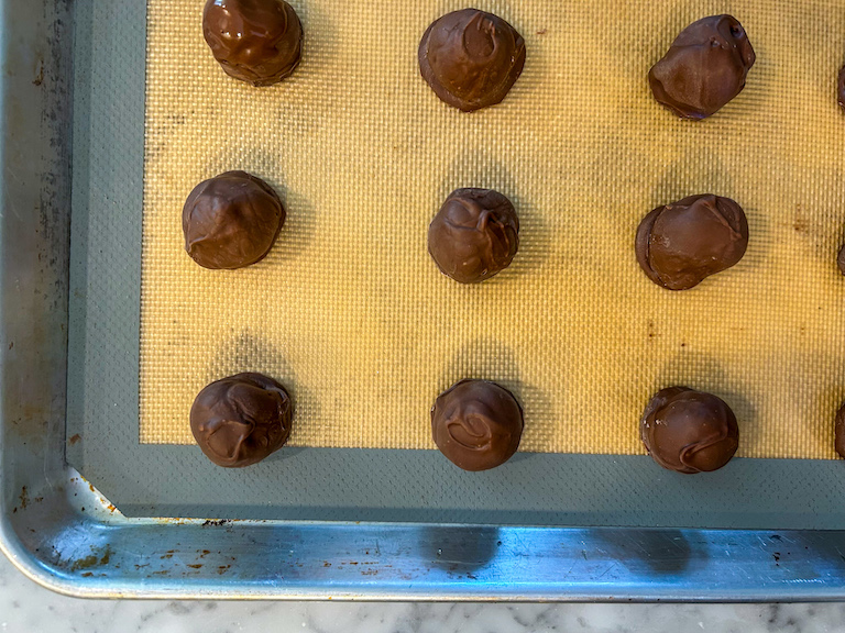 Chocolate-dipped cherries on a tray