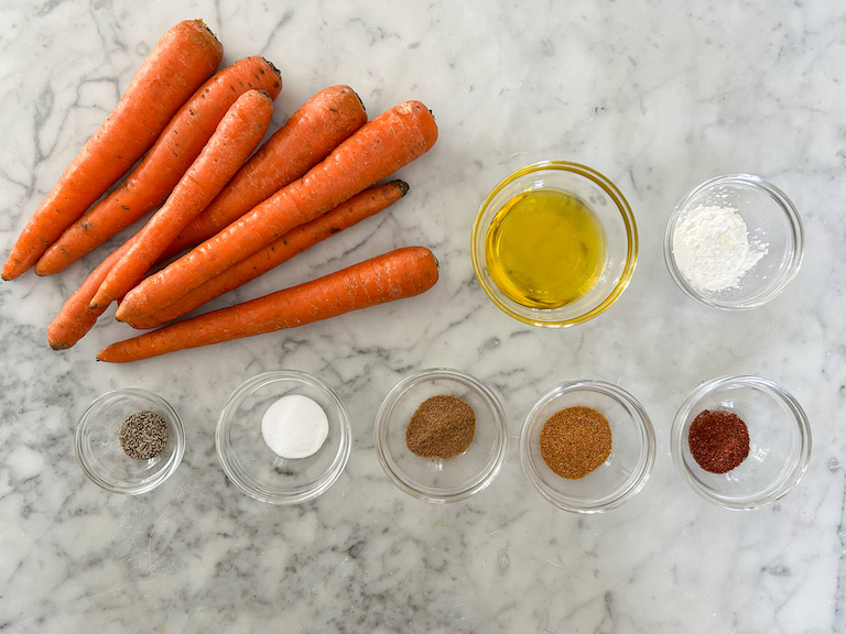Carrot fry recipe ingredients on a marble surface