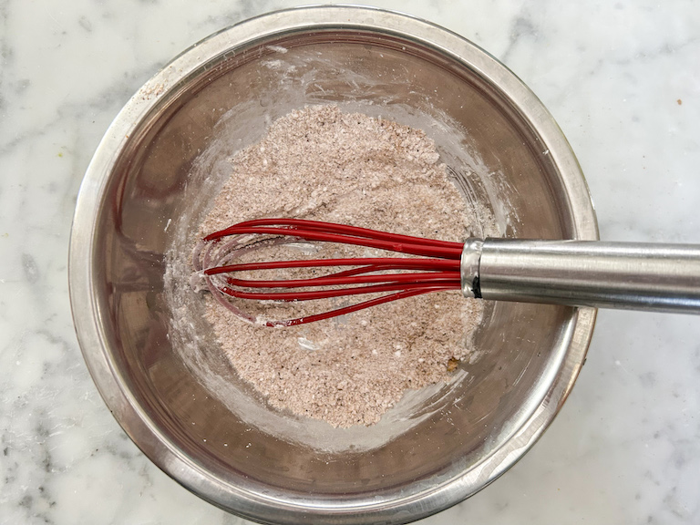 Dry ingredients in a bowl with a whisk