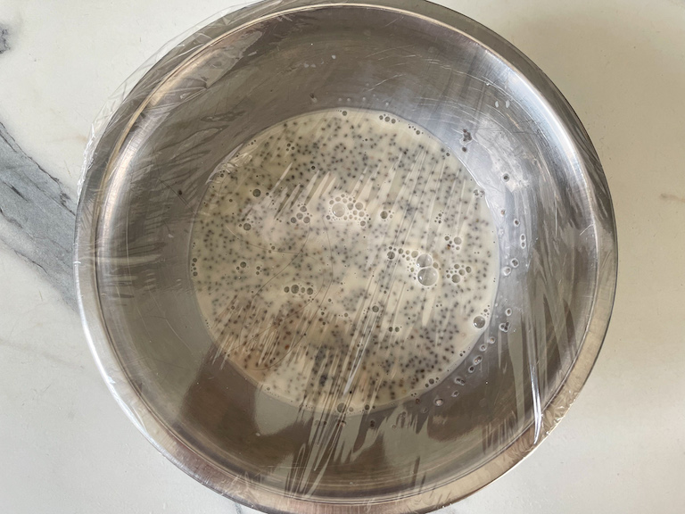 A bowl of chia seed pudding covered with plastic wrap