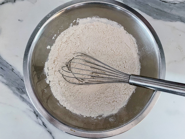 Dry ingredients in a bowl with a whisk