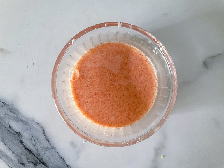 Custard powder and lemon juice whisked together in a small glass dish