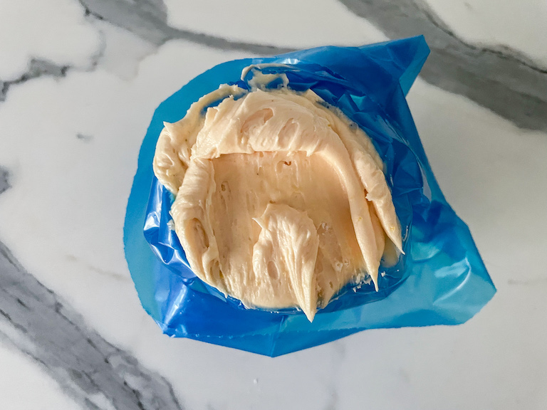 Piping bag of lemon buttercream filling