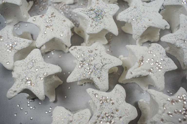 Star shaped marshmallows on a white surface