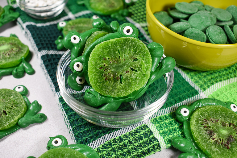 A dish of green chocolae frogs
