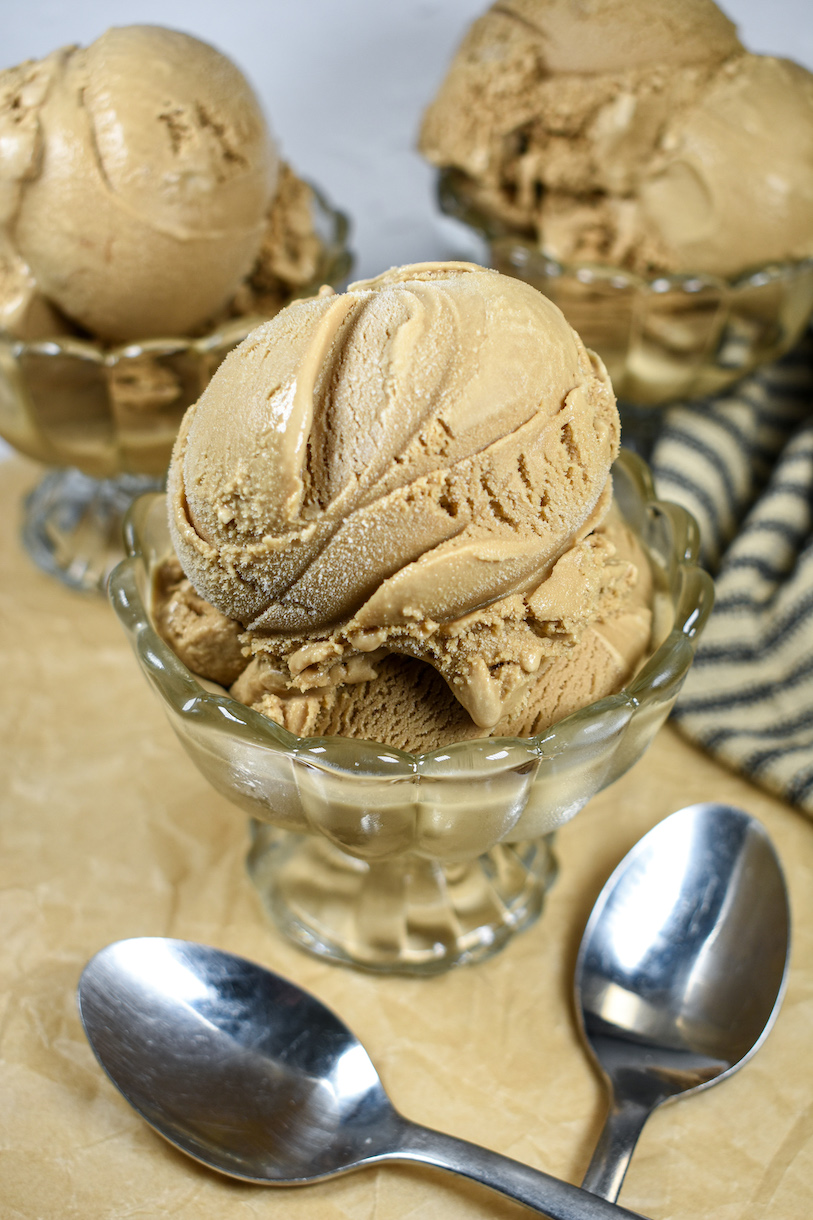 Dishes of coffee ice cream on a sheet of parchment
