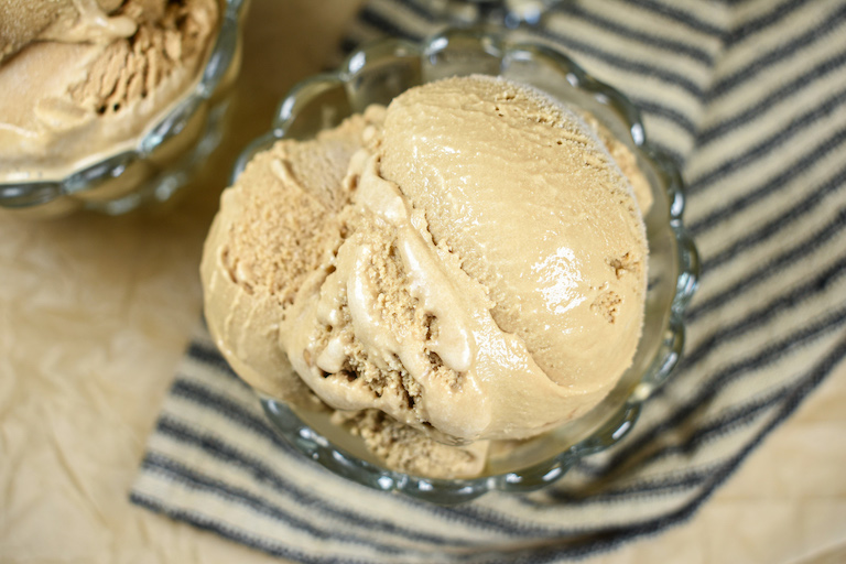 Dish of cold brew ice cream with a striped towel