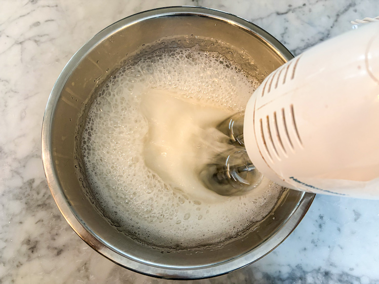 Hand mixer mixing homemade marshmallows