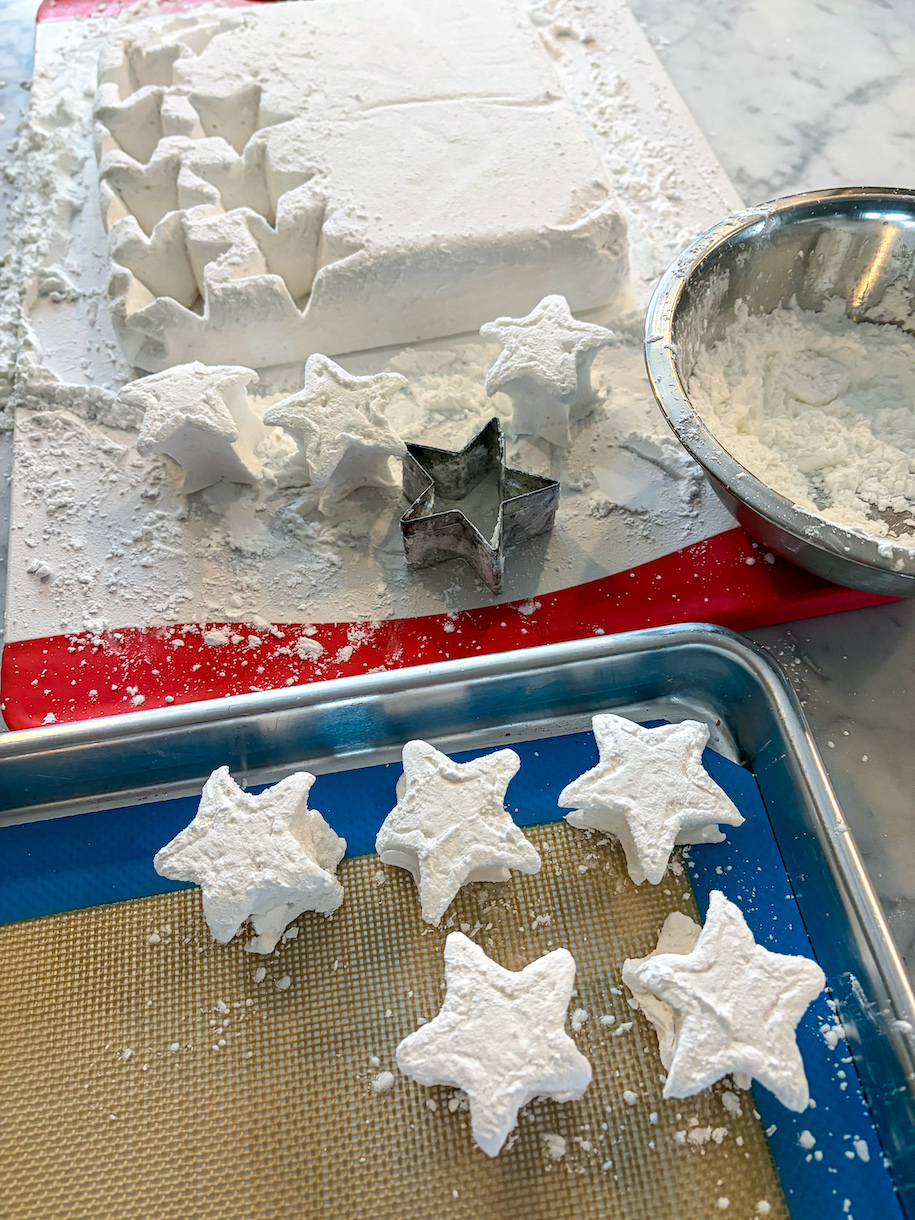 Tray of marshmallows, marshmallow slab, and a star cutter