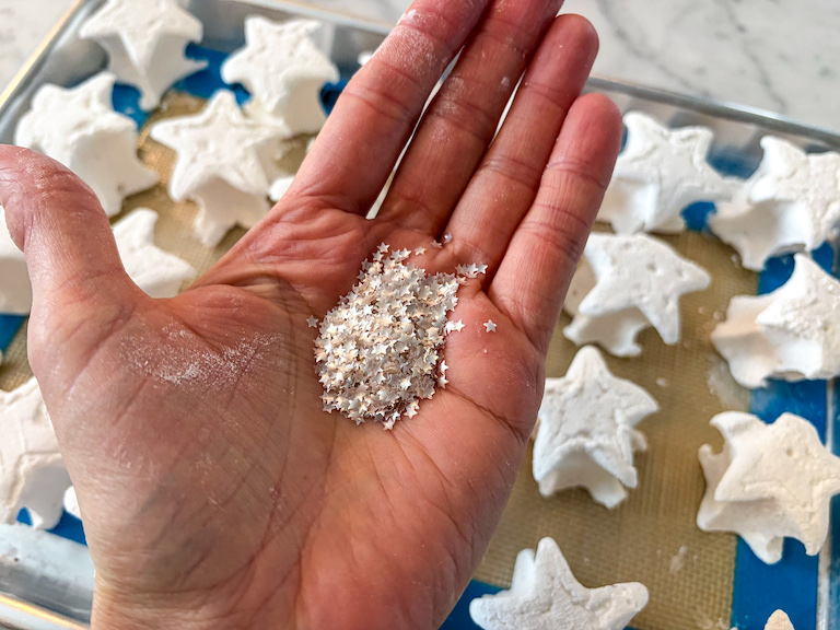 Hand holding a handful of foil hearts