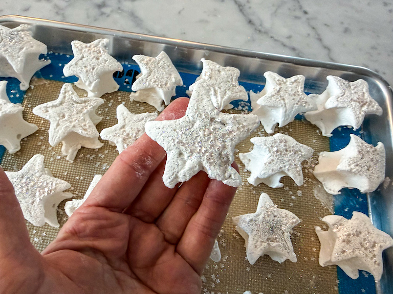 Hand holding a star marshmallow