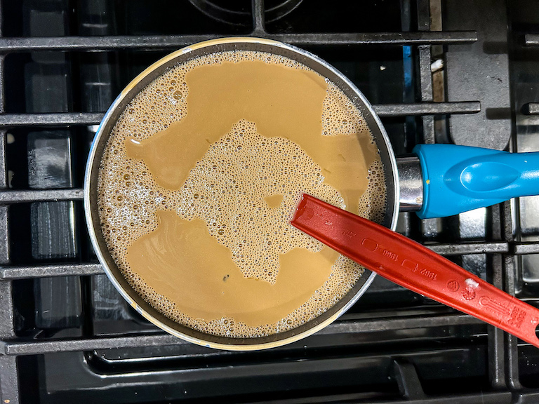 Coffee ice cream recipe base cooking on the stovetop
