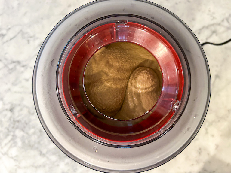 Coffee ice cream churning in an ice cream maker