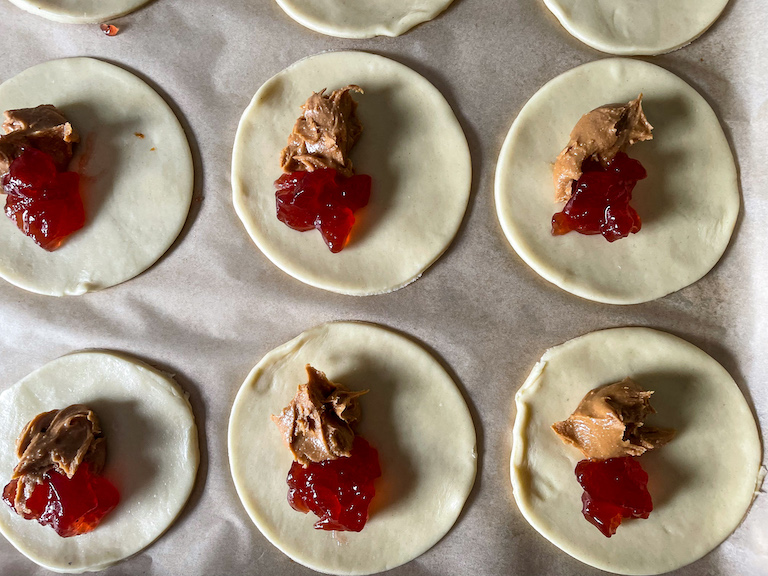 peanut butter and jelly spooned on top of unbaked pastry