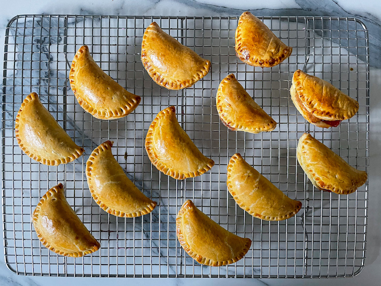 Hand pies cooling on a wire rack