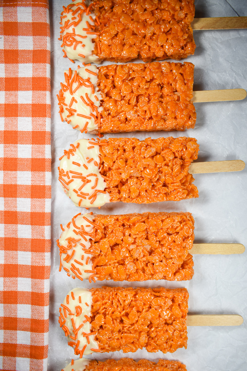 a row of creamsicle krispie treats and an orange towel