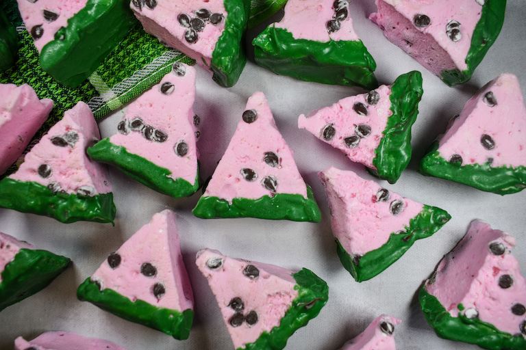 Wedge shaped pink watermelon marshmallows with chocolate chips and melted green chocolate