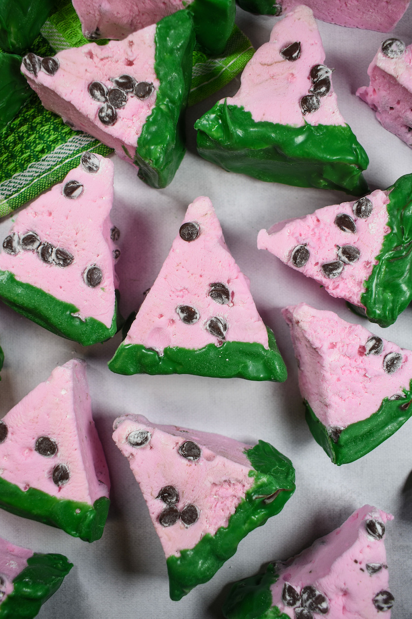 Watermelon marshmallows arranged on a white surface