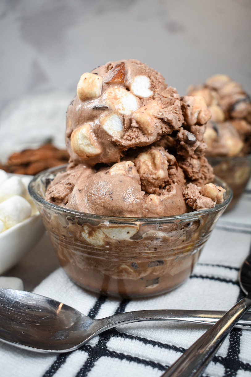 A dish of rocky road ice cream and a spoon