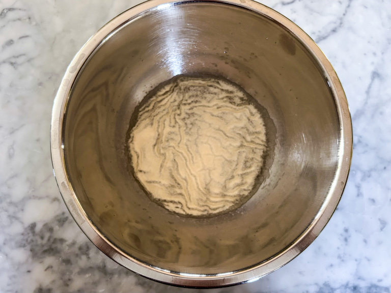 Powdered gelatin soaking in a bowl of water